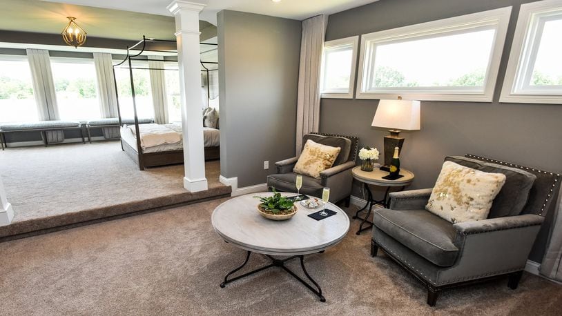The Marshall by Fischer Homes is one of ten custom homes available for viewing during the Home Builders Association of Greater Cincinnati Homearama 2019 in the Kensington neighborhood in Deerfield Township in Warren County. The show runs June 8-23. This is a seating area within the master suite. NICK GRAHAM/STAFF