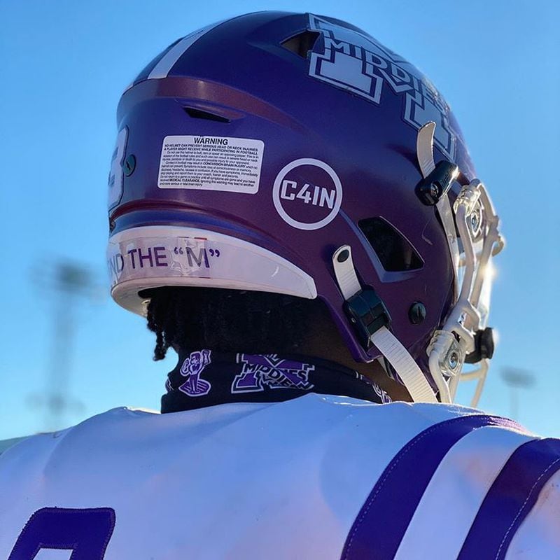 The death of a Middletown 4th grader last week was commemorated Friday by Middletown High School&#39;s football team who wore decals on their helmets honoring the passing of Cain Adkins. (Provided PhotoJournal-News)