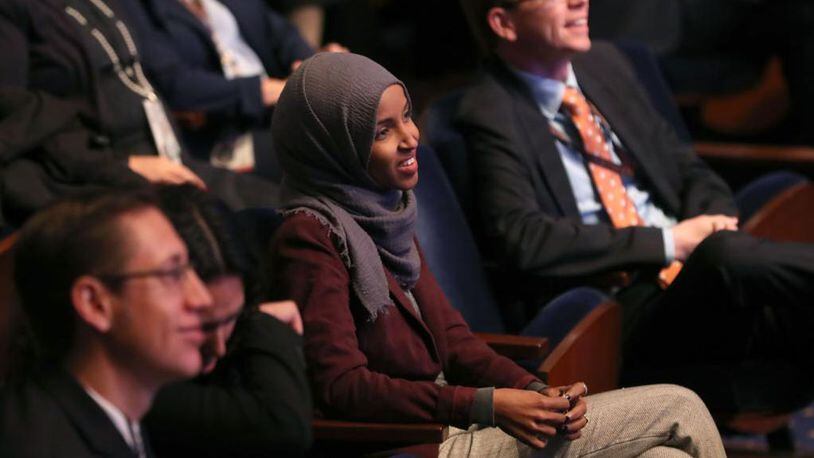 New member-elect Ilhan Omar, D-Minn., center, attends a welcome briefing sponsored by the the House Administration Committee on Capitol Hill November 15, 2018 in Washington, DC. The new 116th congress will be sworn in on January 3, 2019. Omar wears a headscarf and, under current rules in the House, headwear is banned on the floor.