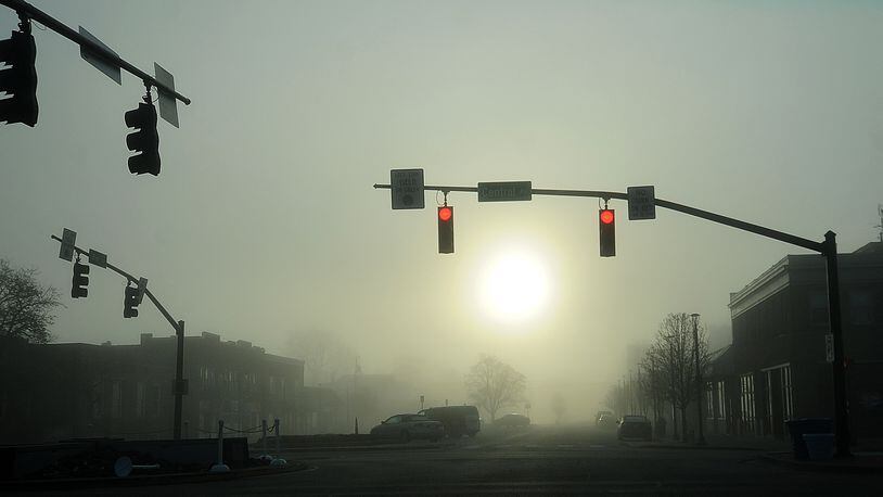 Early morning fog in downtown Fairborn Tuesday, March 28, 2023. MARSHALL GORBY\STAFF