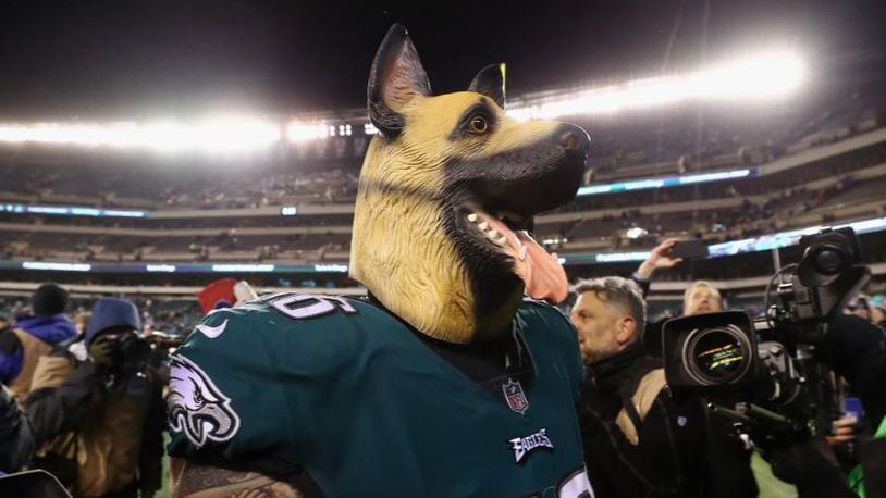 Eagles defensive end Chris Long dons a dog mask after Philadelphia's 15-10 victory against Atlanta. The Eagles were underdogs heading into Saturday's game.