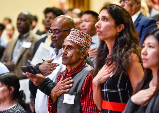 Nearly 100 people become U.S. citizens at naturalization ceremony at Miami Hamilton