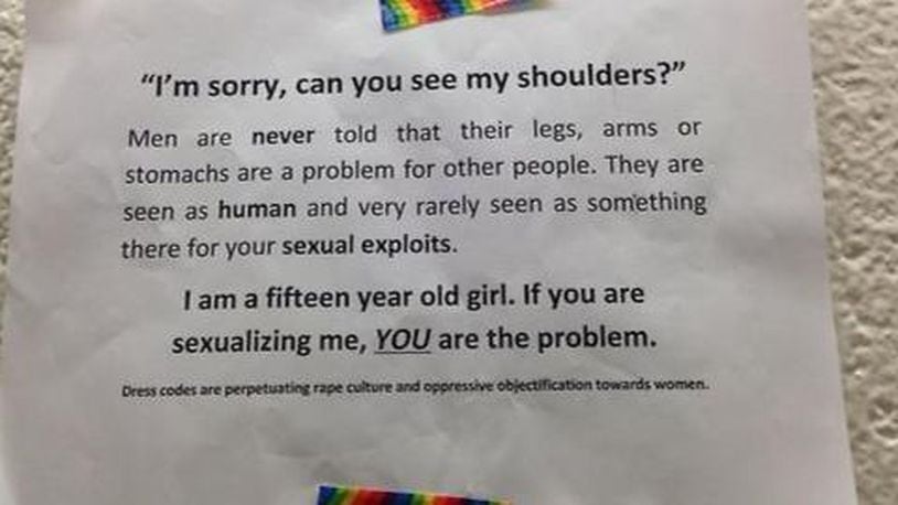 Students are rising up against dress codes that single out girls and hold them accountable for what boys may think or do. This is a sign that girls posted in one high school to protest sexist dress codes. (Photo: The Atlanta Journal-Constitution)
