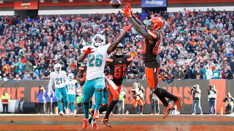 CLEVELAND, OH - NOVEMBER 24: Jarvis Landry #80 of the Cleveland Browns catches a pass for a touchdown over the defense of Steven Parker #26 of the Miami Dolphins during the second quarter at FirstEnergy Stadium on November 24, 2019 in Cleveland, Ohio. (Photo by Kirk Irwin/Getty Images)