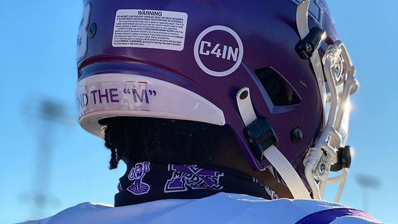 The death of a Middletown 4th grader last week was commemorated Friday by Middletown High School&#39;s football team who wore decals on their helmets honoring the passing of Cain Adkins. (Provided Photo\Journal-News)