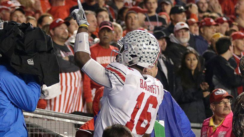 MADISON, WI - OCTOBER 15: J.T. Barrett #16 of the Ohio State Buckeyes celebrates after making a touchdown during the fourth quarter against the Wisconsin Badgers at Camp Randall Stadium on October 15, 2016 in Madison, Wisconsin. (Photo by Mike McGinnis/Getty Images)