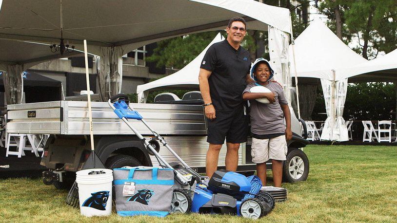 Carolina Panthers coach dropped in on 12-year-old Jalyin Clyburn with a brand-new lawnmower.