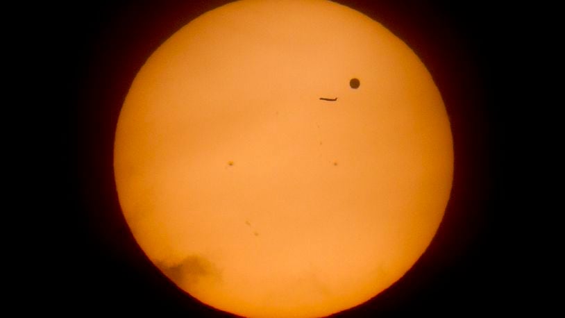 A regional jet passed in front of Venus in this June 5, 2012 file photo shot through a Baader Solar Filter.