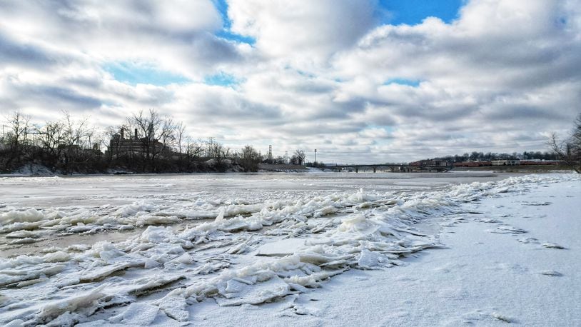 Ice forms on the surface of the Great Miami River at Combs Park in Hamilton Tuesday, Jan. 16, 2024, after several days of below freezing temperatures. NICK GRAHAM/STAFF