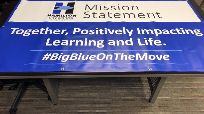 Hamilton Schools officials recently unveiled a new Twitter hashtag - “Big Blue On The Move” - along with a new mission statement as the district looks to bring a sharper marketing edge to its public image. Banners with the new slogan and mission statement will be featured in Hamilton Schools in the coming school year. More area schools are creating and tweaking their social media identifiers and mission statements to better market their districts to the public. (Provided photo/Journal-News)