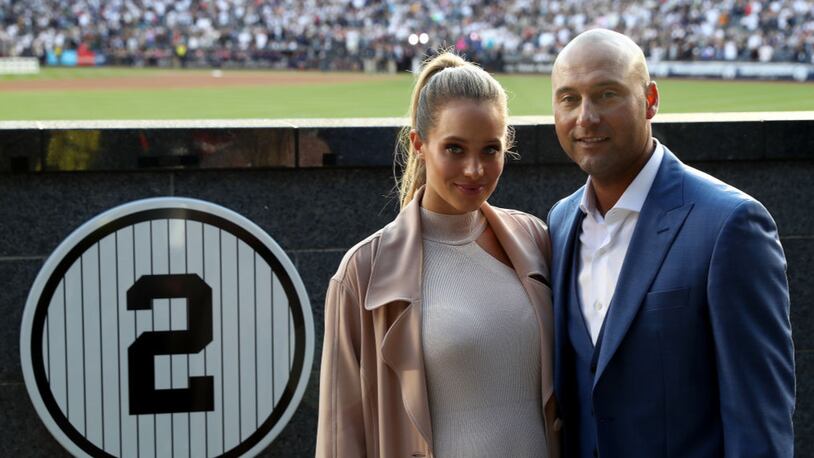 NEW YORK, NY - MAY 14:  Hannah Jeter and Derek Jeter pose next to his number in Monument Park at Yankee Stadium during the retirement cerremony of Jeter's jersey #2 at Yankee Stadium on May 14, 2017 in the Bronx borough of New York City.  (Photo by Elsa/Getty Images)