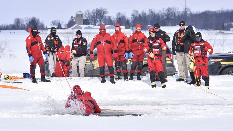 The Butler County Sheriff's Office held a water rescue training on an ice covered pond Tuesday,  February 16, 2021 on Tolbert Road in Wayne Township. NICK GRAHAM / STAFF