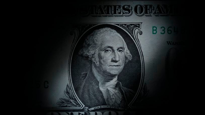 FILE - The likeness of George Washington is seen on a U.S. one dollar bill, March 13, 2023, in Marple Township, Pa. AP FILE