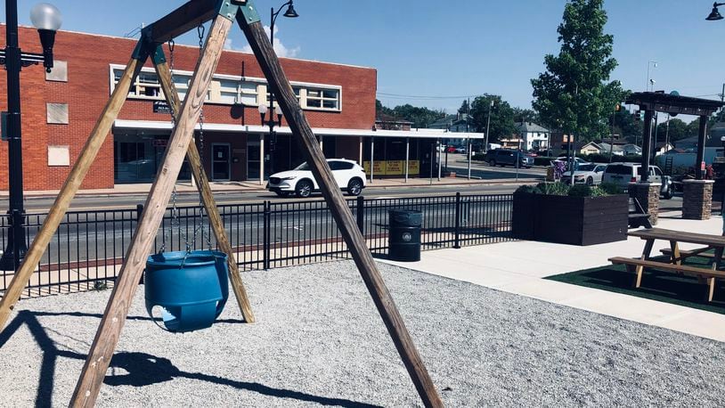 Pictured is Big Baby Swing, an art installation at Hamilton's Urban Backyard on Main Street. It's by the University of Cincinnati professor of art Matt Lynch and depicts an adult-size version of the bucket swing design typically found at public parks. This enlarged version is made from a common plastic barrel. Viewers are encouraged to interact with the swing. PROVIDED