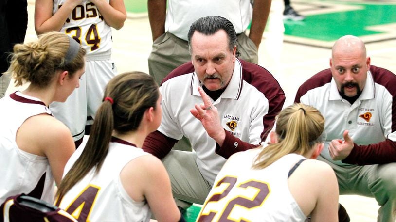 Ross coach Rodney Parrett (middle) talks with his squad during a Division I sectional game against Anderson at Harrison on Feb. 13, 2014. JOURNAL-NEWS FILE PHOTO