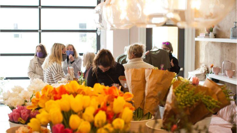 People gathered at a recent Farmer's Collective event at the Two Little Buds flower shop. PROVIDED