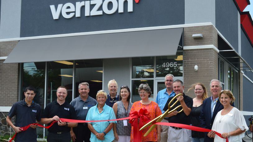 A ribbon cutting at a new Verizon store at 4965 College Corner Pike in August. CONTRIBUTED