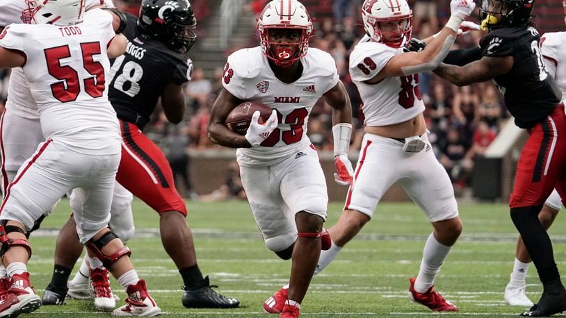 Miami (Ohio) running back Kenny Tracy (33) scores a touchdown during the second half of an NCAA college football game against Cincinnati, Saturday, Sept. 4, 2021, in Cincinnati. (AP Photo/Jeff Dean)