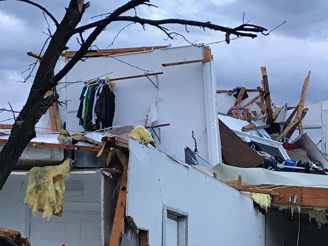 PHOTOS: Tornado-damaged communities dig out, clean up