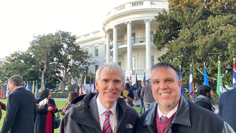 Liberty Twp. resident Troy Miller, right, poses with Ohio Sen. Rob Portman after President Joe Biden's signing this week of a $1 trillion infrastructure bill outside of the White House. Miller, who president of the Amalgamated Transit Union Local 627 in Cincinnati, says it was thrill to be so close to the historic signing, which Portman was instrumental in making happen. (Provided Photo\Journal-News)