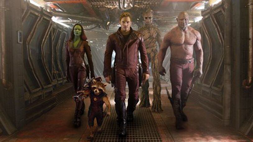 This image released by Disney - Marvel shows, from left, Zoe Saldana, the character Rocket Racoon, voiced by Bladley Cooper, Chris Pratt, the character Groot, voiced by Vin Diesel and Dave Bautista in a scene from "Guardians Of The Galaxy." (AP Photo/Disney - Marvel)