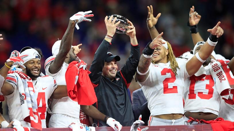 INDIANAPOLIS, INDIANA - DECEMBER 07: Ryan Day the head coach of the Ohio State Buckeyes holds the winner's trophy after the BIG Ten Football Championship game against the Wisconsin Badgers at Lucas Oil Stadium on December 07, 2019 in Indianapolis, Indiana. (Photo by Andy Lyons/Getty Images)