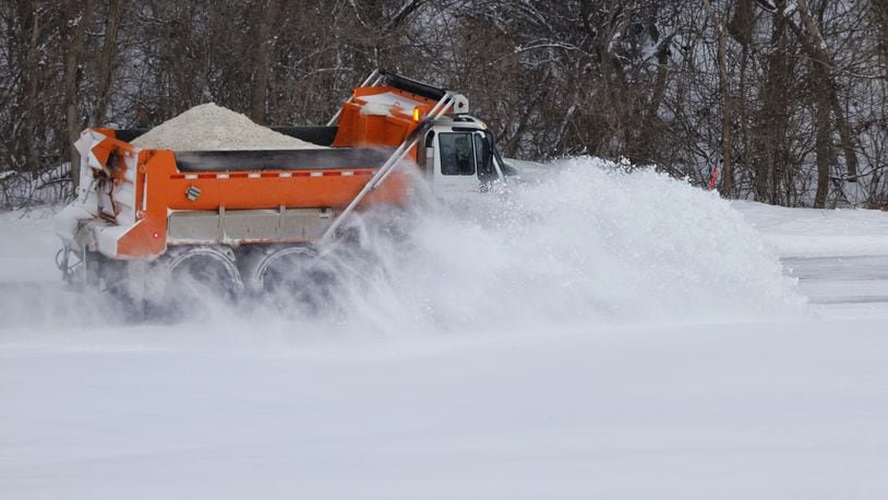 A Butler County Engineer's Office snow plow clears snow off of Elk Creek Road Friday, Feb. 4, 2022. NICK GRAHAM/STAFF