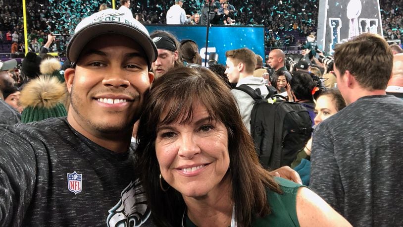 Lakota West graduate and Philadelphia Eagles linebacker Jordan Hicks poses with his mom, Kelly Justice, on the field at U.S. Bank Stadium after winning Super Bowl LII on Sunday. SUBMITTED PHOTO