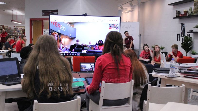 Hundreds of students at Lakotas’ two high schools are fulfilling their foreign language requirements by taking classes in American Sign Language (ASL). The district is also using video conferencing, collaborative learning (pictured) so students from the Lakota East and Lakota West high schools can learning ASL from one another. (Provided photo/Journal-News)