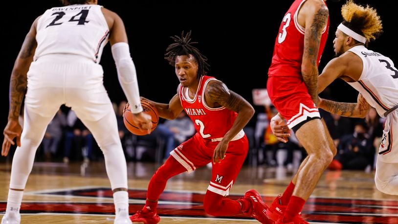 Miami University's Mekhi Lairy dribbles the ball during their basketball game against University of Cincinnati Wednesday, Dec. 1, 2021 at Millett Hall on Miami University campus in Oxford. Lairy is one of the RedHawks captains this season. NICK GRAHAM / STAFF