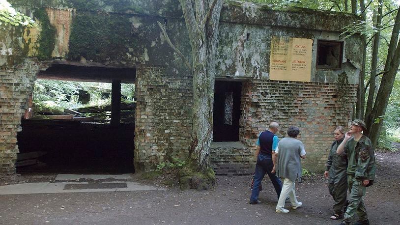 FILE - Tourists visit the ruins of Adolf Hitler's headquarters the "Wolf's Lair" in Gierloz, northeastern Poland, July 17, 2004 where his chief of staff members made an unsuccessful attempt at Hitler's life on July 20, 1944. Polish prosecutors have discontinued an investigation into human skeletons found at Wolf's Lair where German dictator Adolf Hitler and other Nazi leaders spent time during World War II because the advanced state of decay made it impossible to determine the cause of death, a spokesman said Monday, May 6, 2024. (AP Photo/Czarek Sokolowski, File)