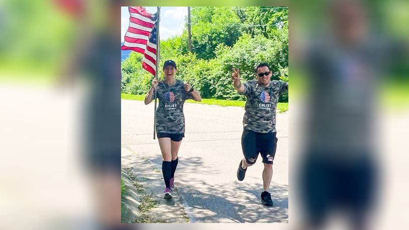 Middletown Mayor Nicole Condrey, accompanied by Master Sergeant Ben Johnis, an Air Force pararescue jumper and member of Team Fastrax, ran 30 miles during 24 hours Monday to raise awareness about the dangers of brain injuries. SUBMITTED PHOTO