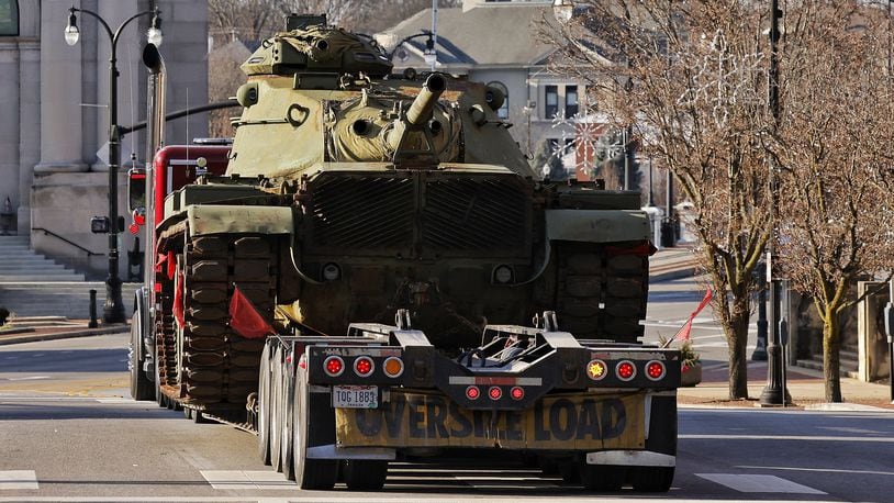A military tank is carried on a trailer through downtown Hamilton Tuesday, Dec 14, 2021. NICK GRAHAM / STAFF