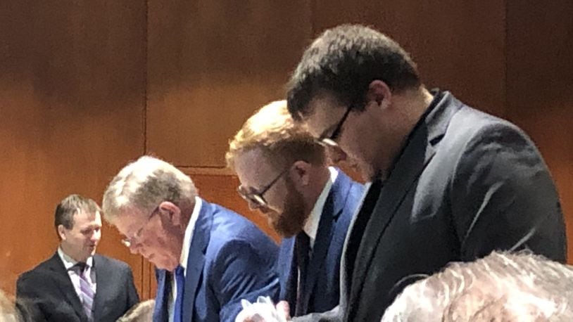John Hopkins and the Chicarelli defense team prepare for trial Thursday. Warren County Prosecutor David Fornshell is in the background. STAFF/LAWRENCE BUDD