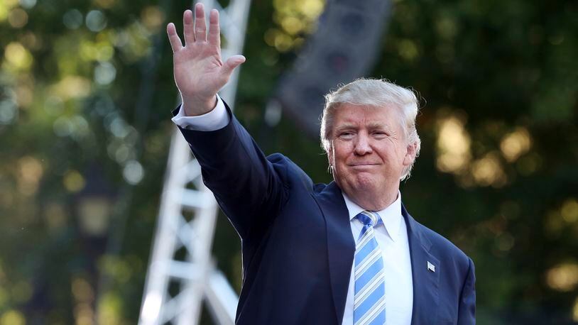 Donald Trump waves to the crowd after finishing his speech at a campaign stop at Regent University in Virginia Beach, Va., on Saturday, Oct. 22, 2016. (Steve Earley/The Virginian-Pilot via AP)