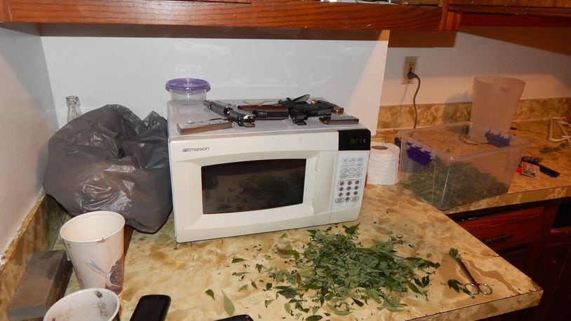The Butler County Sheriff’s Office and Hamilton Police Department jointly executed a search warrant Tuesday, April 7, at 220 North D St. in Hamilton, where they found and confiscated approximately 63 marijuana plants and two loaded handguns.
