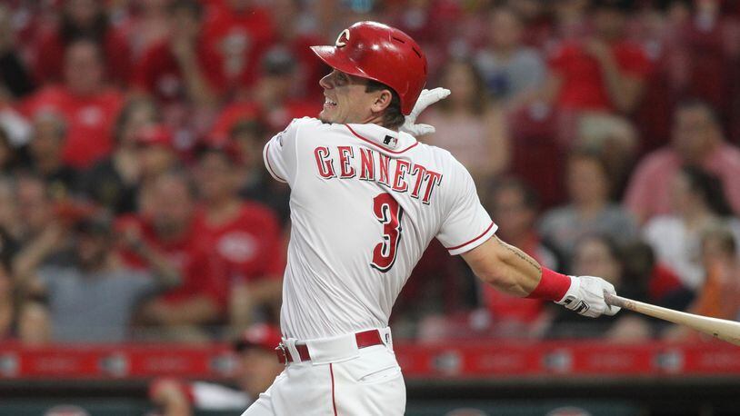The Reds Scooter Gennett drives in a run with a double against the Pirates on Tuesday, May 22, 2018, at Great American Ball Park in Cincinnati. David Jablonski/Staff