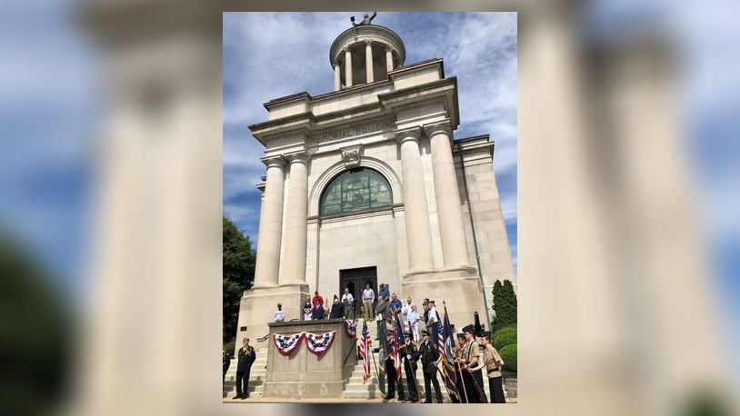 More than 100 people attended a Memorial Day service Monday morning outside the Soldiers, Sailors and Pioneers Monument in Hamilton. Hamilton Mayor Pat Moeller served as master of ceremonies and the event included six local honor guards, speeches, a 21-gun salute and the playing of Taps. RICK McCRABB/STAFF