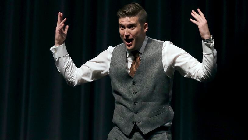 White Nationalist Richard Spencer tries to get students to shout louder as they clash during a speech Thursday, Oct. 19, 2017, at the University of Florida in Gainesville. (AP Photo/Chris O’Meara)