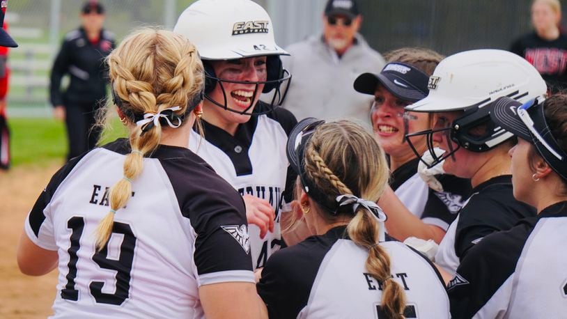 Lakota East's Amber Munoz is swarmed by her teammates after hitting a walk-off home run against Lakota West on Tuesday. Chris Vogt/CONTRIBUTED