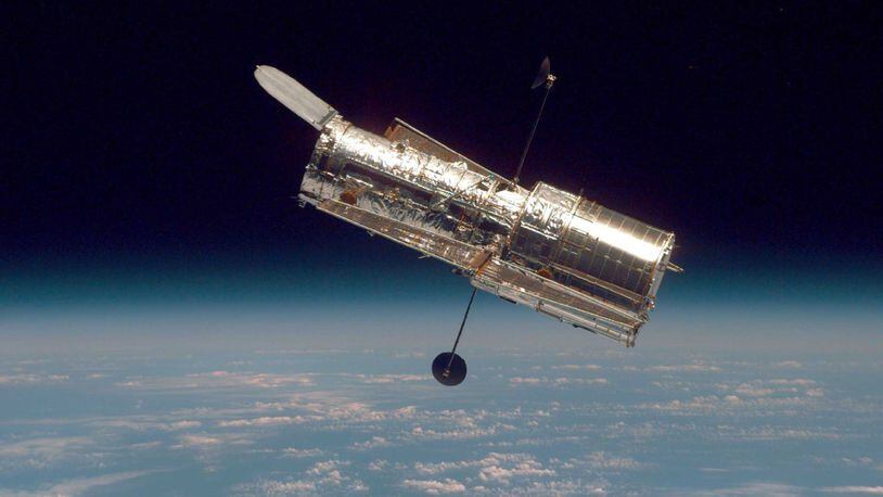 IN SPACE: (FILE PHOTO) In this handout from the National Aeronautical Space Administration, the Hubble Space Telescope drifts through space in a picture taken from the Space Shuttle Discovery during Hubble’s second servicing mission in 1997.