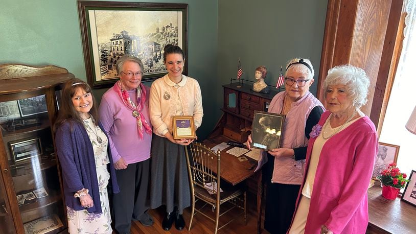 Members of the Lavender Ladies Club of Stella Weiler Taylor Society periodically meet in the Father’s House, part of the former Butler County Children’s Home. Standing in front of Taylor’s desk are, from left, Alice Sizemore, Mary Anne Davis, Carrie Halim, Kathleen Stuckey Fox and Nancy Arthur. RICK McCRABB/CONTRIBUTING WRITER