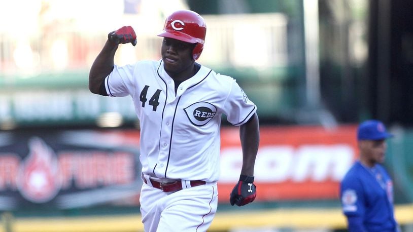 The Reds’ Aristides Aquino rounds the bases after a two-run home run in the second inning against the Cubs on Friday, Aug. 9, 2019, at Great American Ball Park in Cincinnati. David Jablonski/Staff