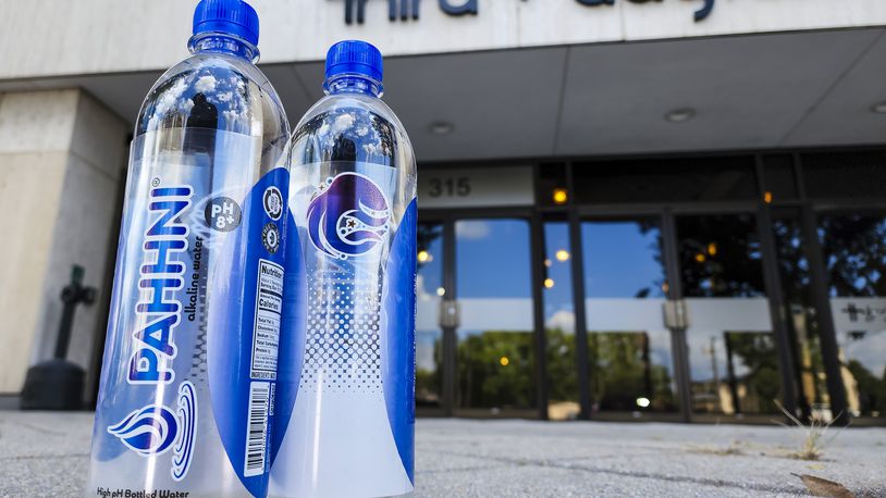 Erik Loomis and Dr. Satinder Bharaj, PhD, co-founders of Pahhni High pH Alkaline Water, have started bottling their products in the Third and Dayton building in Hamilton. NICK GRAHAM/STAFF