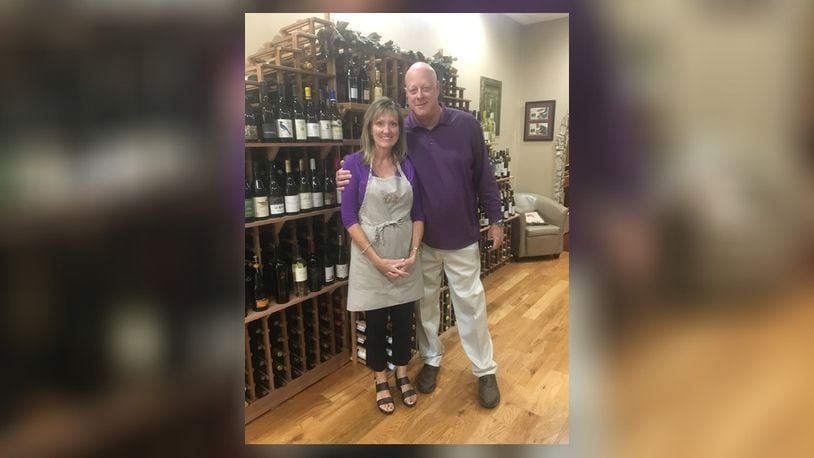 Melanie Cedargren (pictured with her husband, Ted) owns The Spicy Olive, which is celebrating its five-year anniversary with the opening of The Wine Cellar at the West Chester store. CONTRIBUTED
