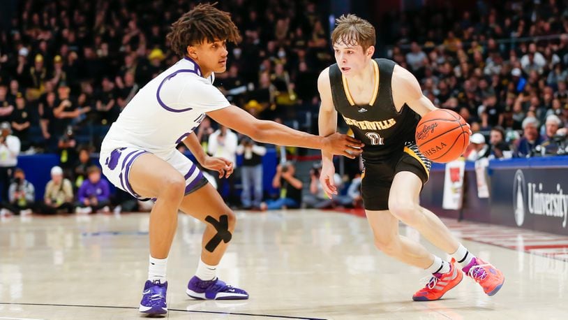 Centerville High School junior Gabe Cupps drives past Pickerington Central junior Devin Royal during the Division I state championship game on Sunday night at UD Arena. CONTRIBUTED PHOTO BY MICHAEL COOPER