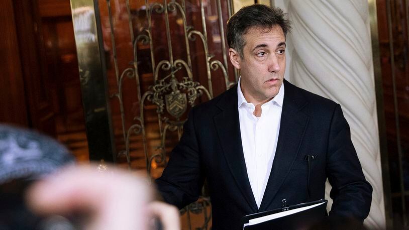 Michael Cohen, former attorney to President Donald Trump, holds a press conference outside his apartment building before departing to begin his prison term Monday, May 6, 2019, in New York. (AP Photo/Kevin Hagen)