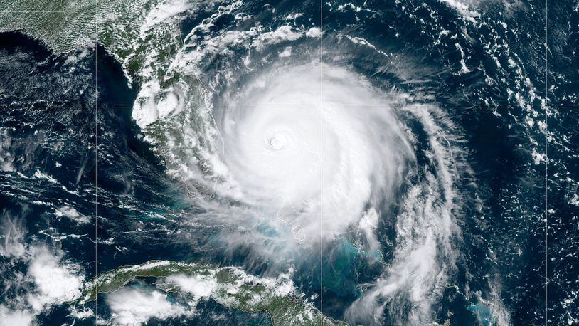 ATLANTIC OCEAN - SEPTEMBER 2: In this NOAA GOES-East satellite handout image, Hurricane Dorian, now a Cat. 4 storm, moves slowly past Grand Bahama Island on September 2, 2019 in the Atlantic Ocean. Dorian moved slowly past the Bahamas at times just 1 mph as it unleashed massive flooding and winds of 150 m.p.h. (Photo by NOAA via Getty Images) *** BESTPIX ***
