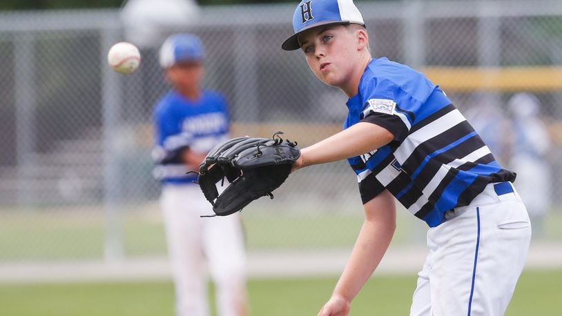 Hamilton West Side’s Davis Avery eyes the ball during Thursday’s winners’ bracket final against Canfield in the Ohio Little League 12-year-old baseball tournament at Ford Park in Maumee. CONTRIBUTED PHOTO BY SCOTT GRAU