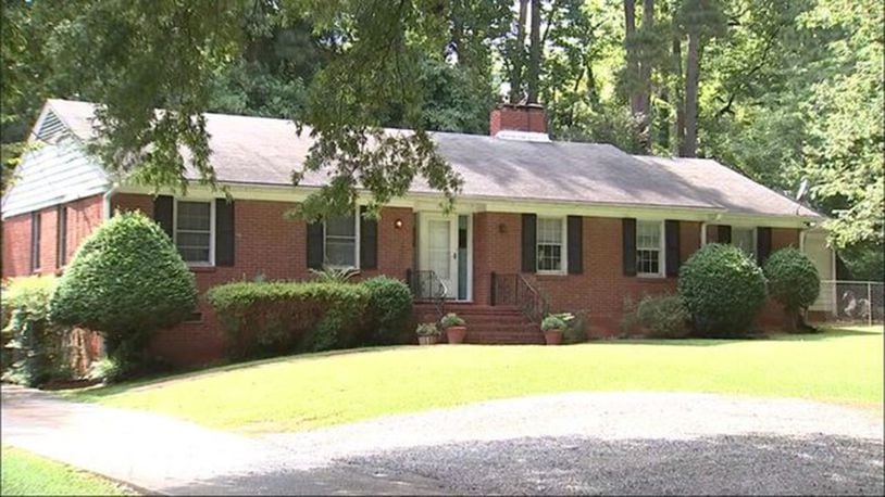 Police say neighbors found a 15-month-old toddler near a busy street after he wandered away from a metro Atlanta home day care.